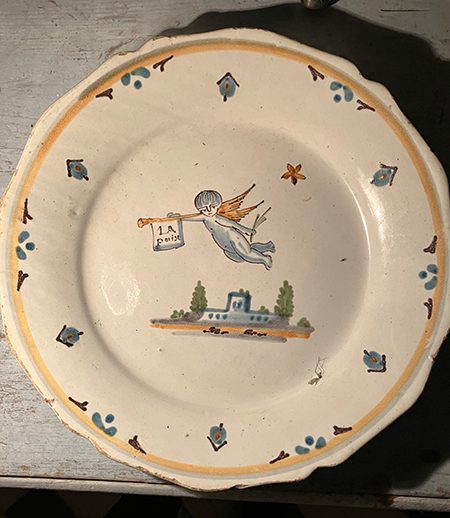 A PLATE THAT HAS SEEN OTHERS